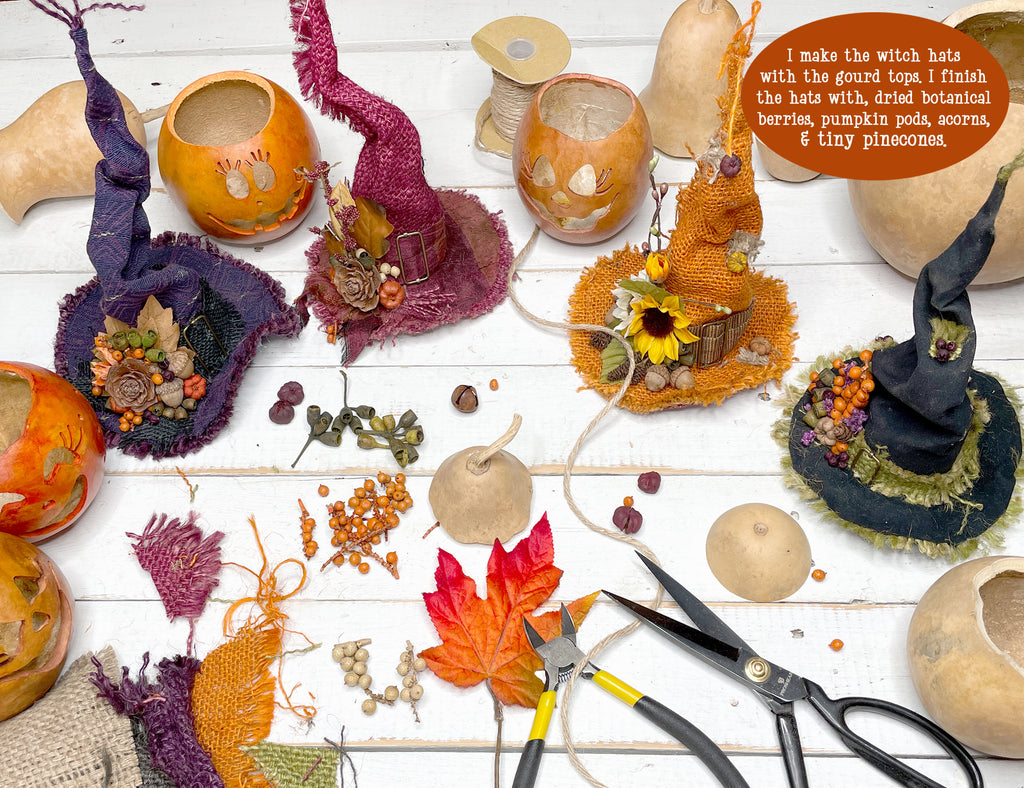Witch hats made from gourds and pumpkins with decorative elements on a wooden surface.