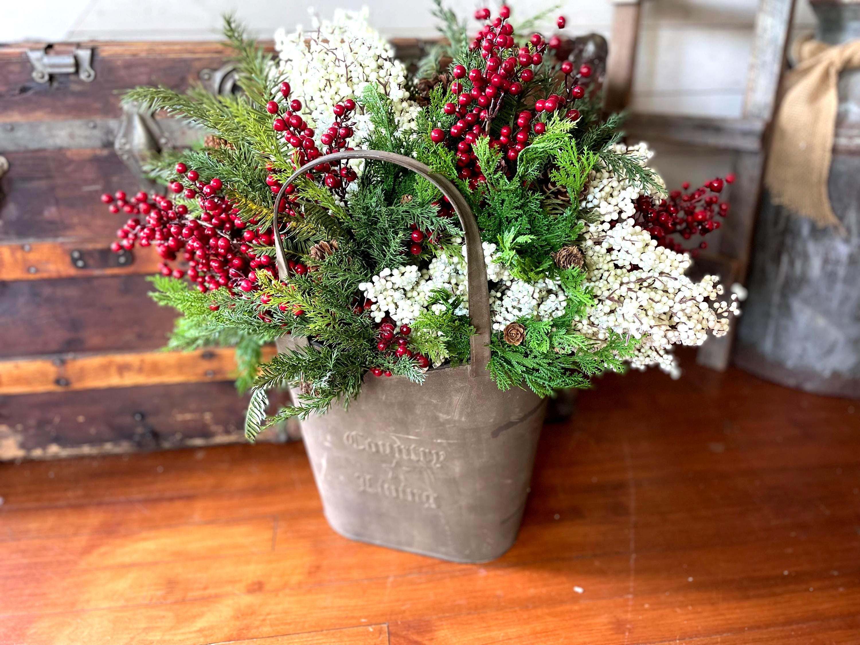 Rustic Christmas decor with greenery, berries, and pinecones