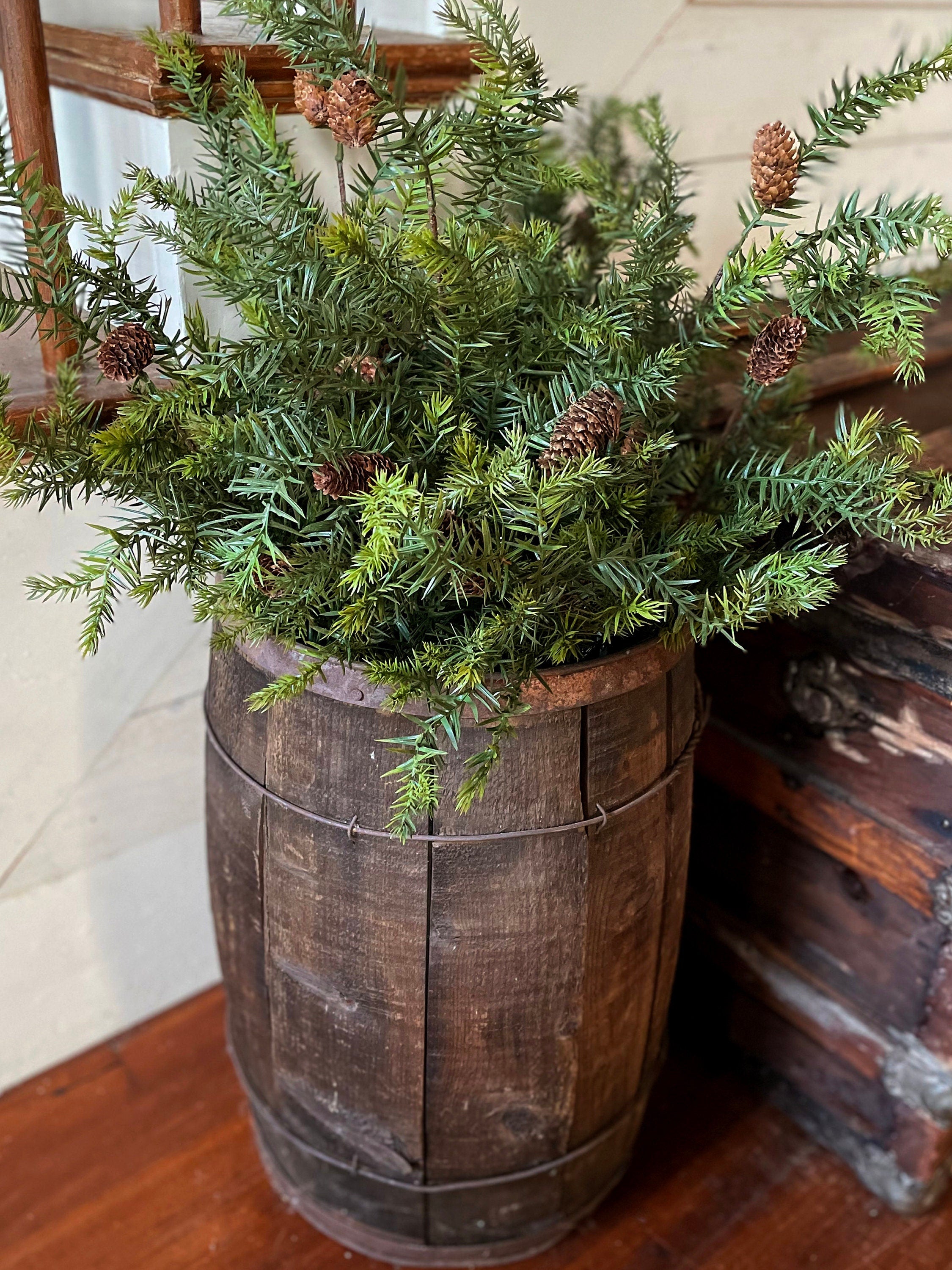 Faux evergreen stems with realistic pinecones for holiday decorating