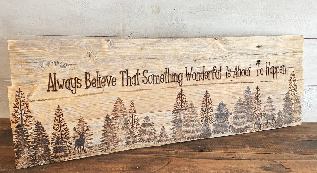 Wooden sign with nature design and motivational quote on a wooden surface, featuring the website www.boutiquebarn.net.