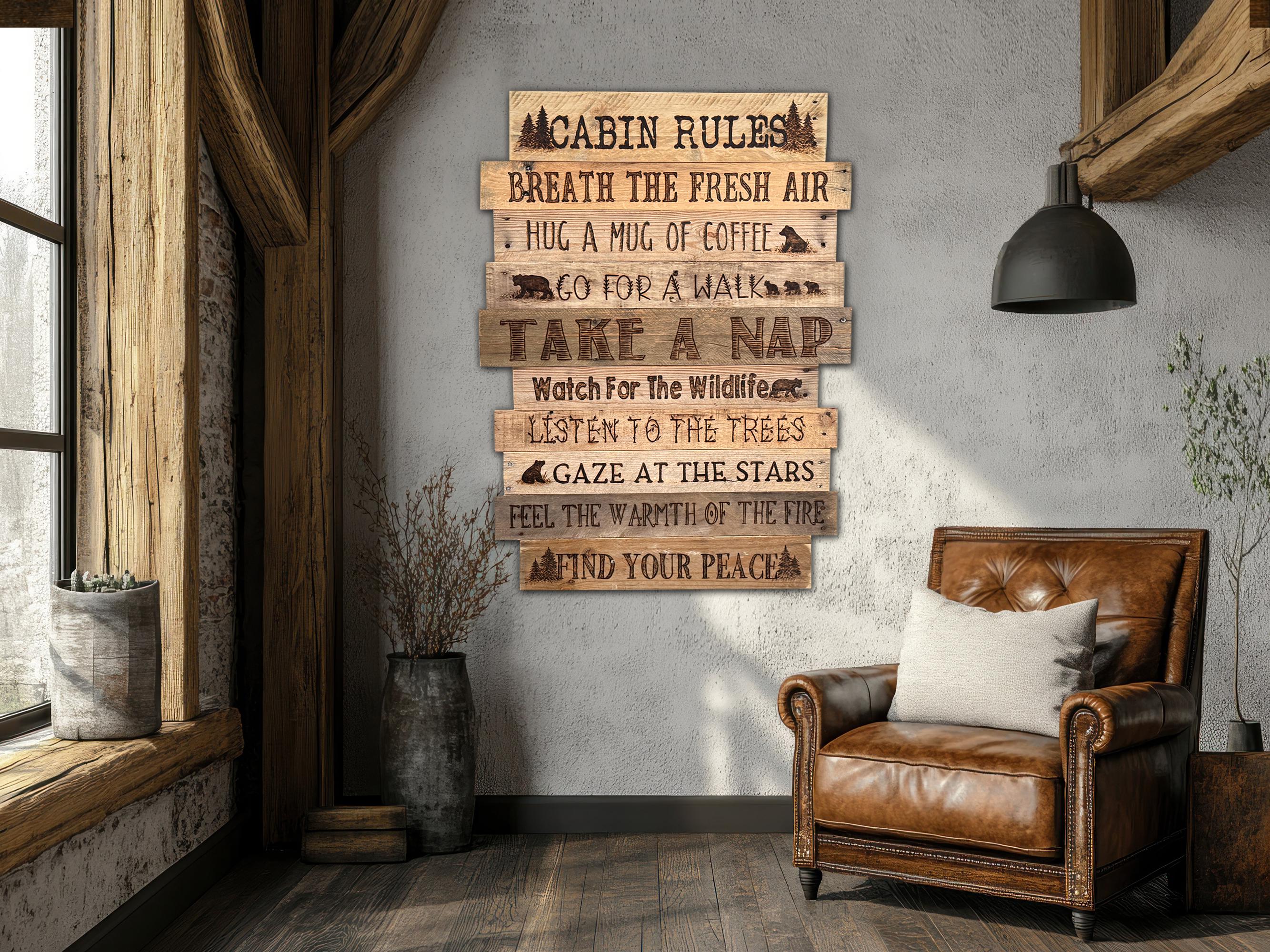 Wooden sign with 'Cabin Rules' on a wall next to a leather armchair.