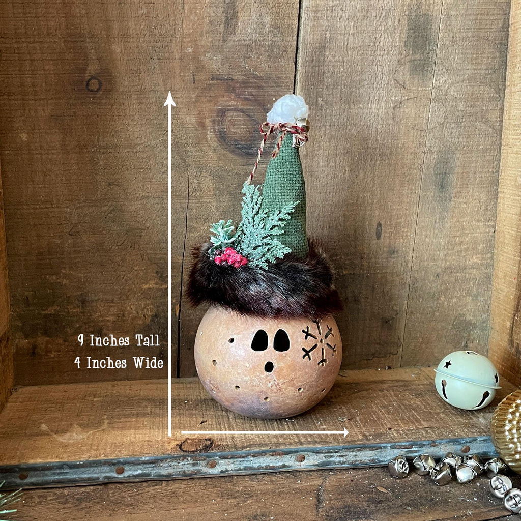 Decorative item on a wooden surface with measurements indicated