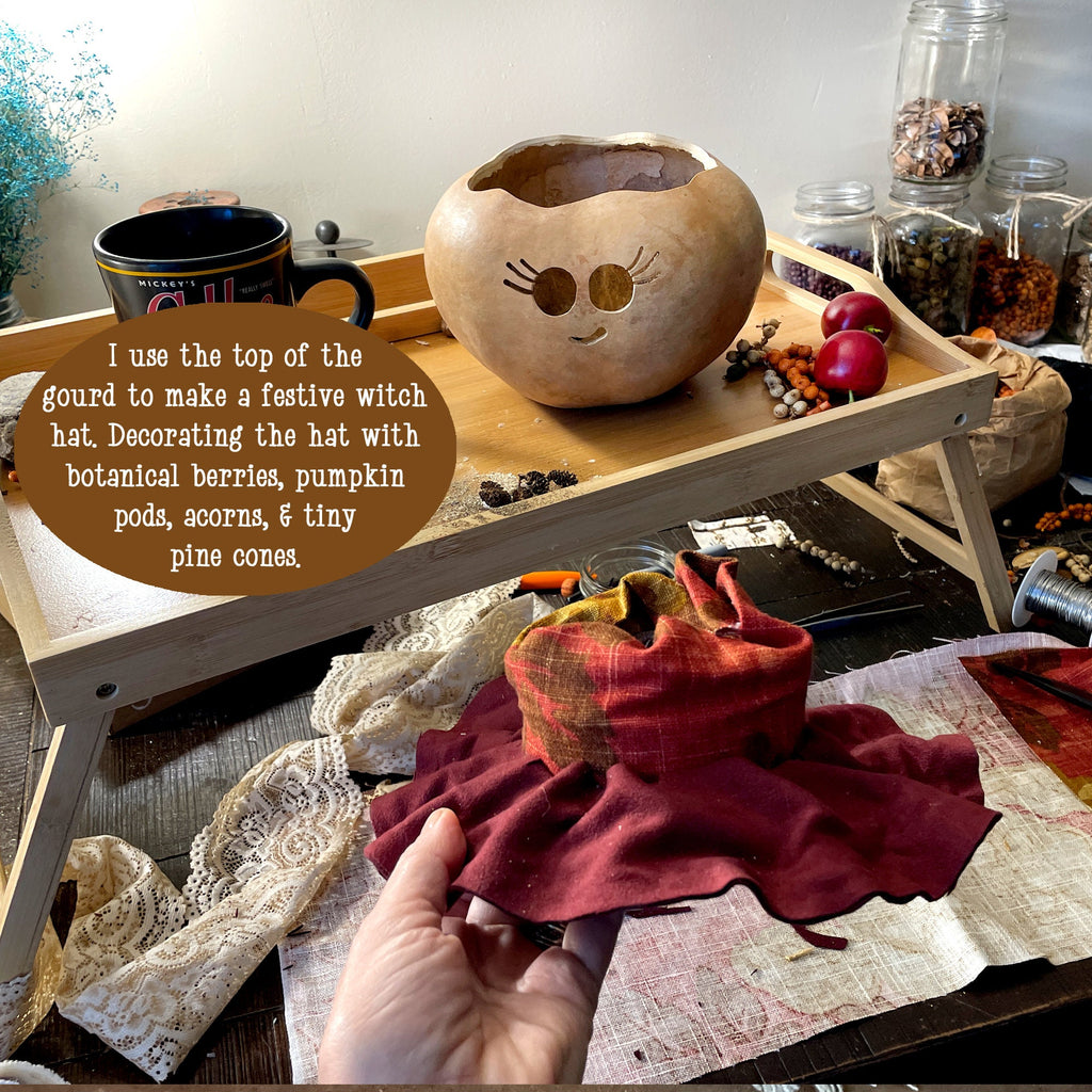 Decorative gourd with face on a table with text overlay