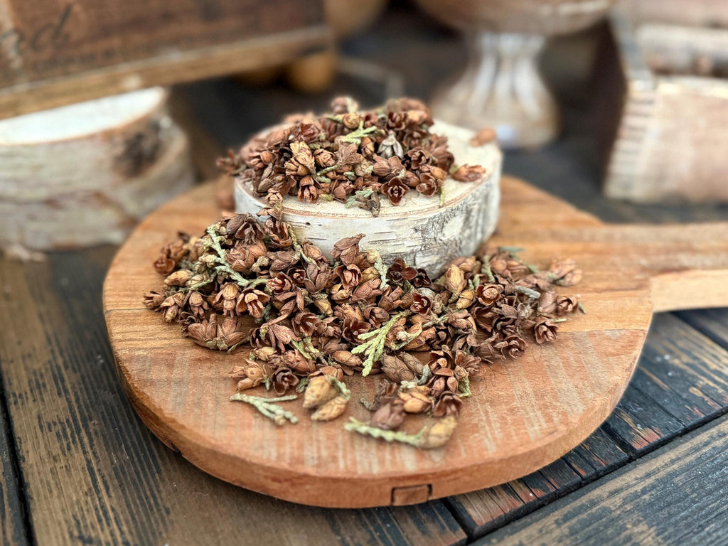 Dried herbs on a wooden board with a rustic background