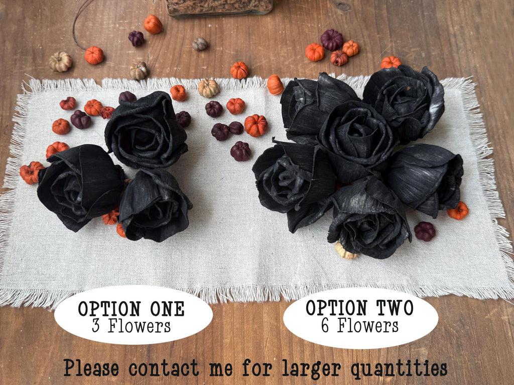 Black flowers on a textured white cloth with options for quantity displayed.