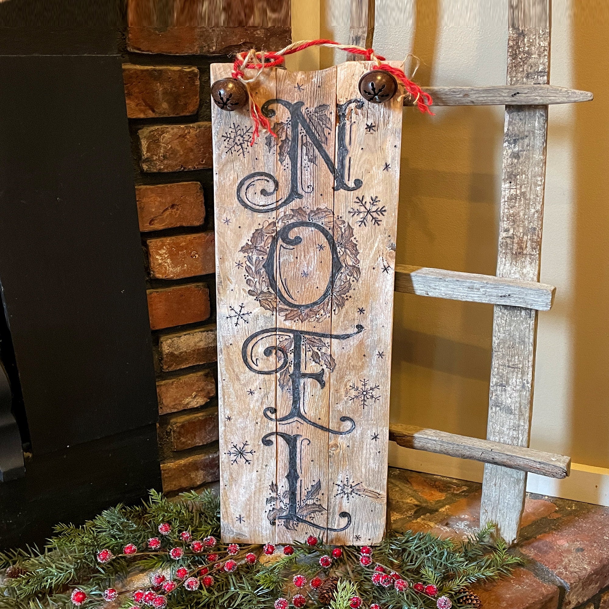 rustic Noel Christmas sign made from reclaimed wood with jingle bells