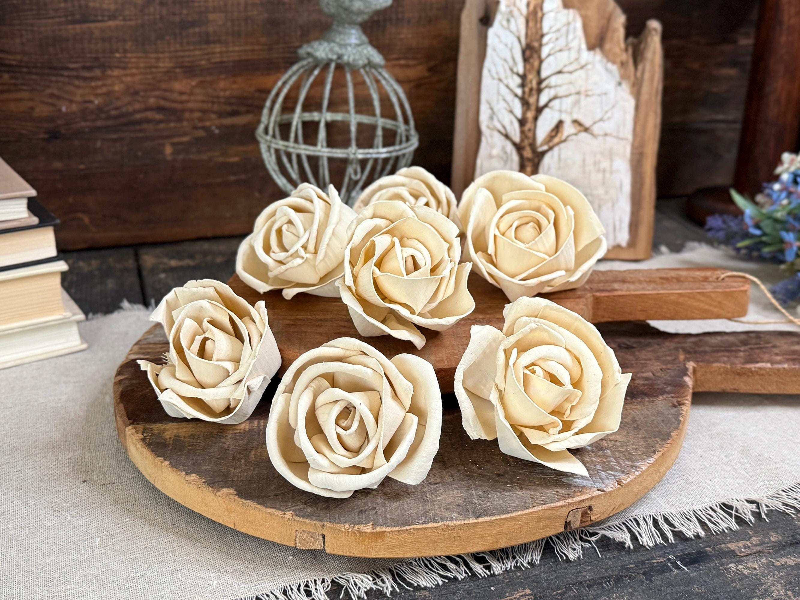 White roses on a wooden board with a rustic background
