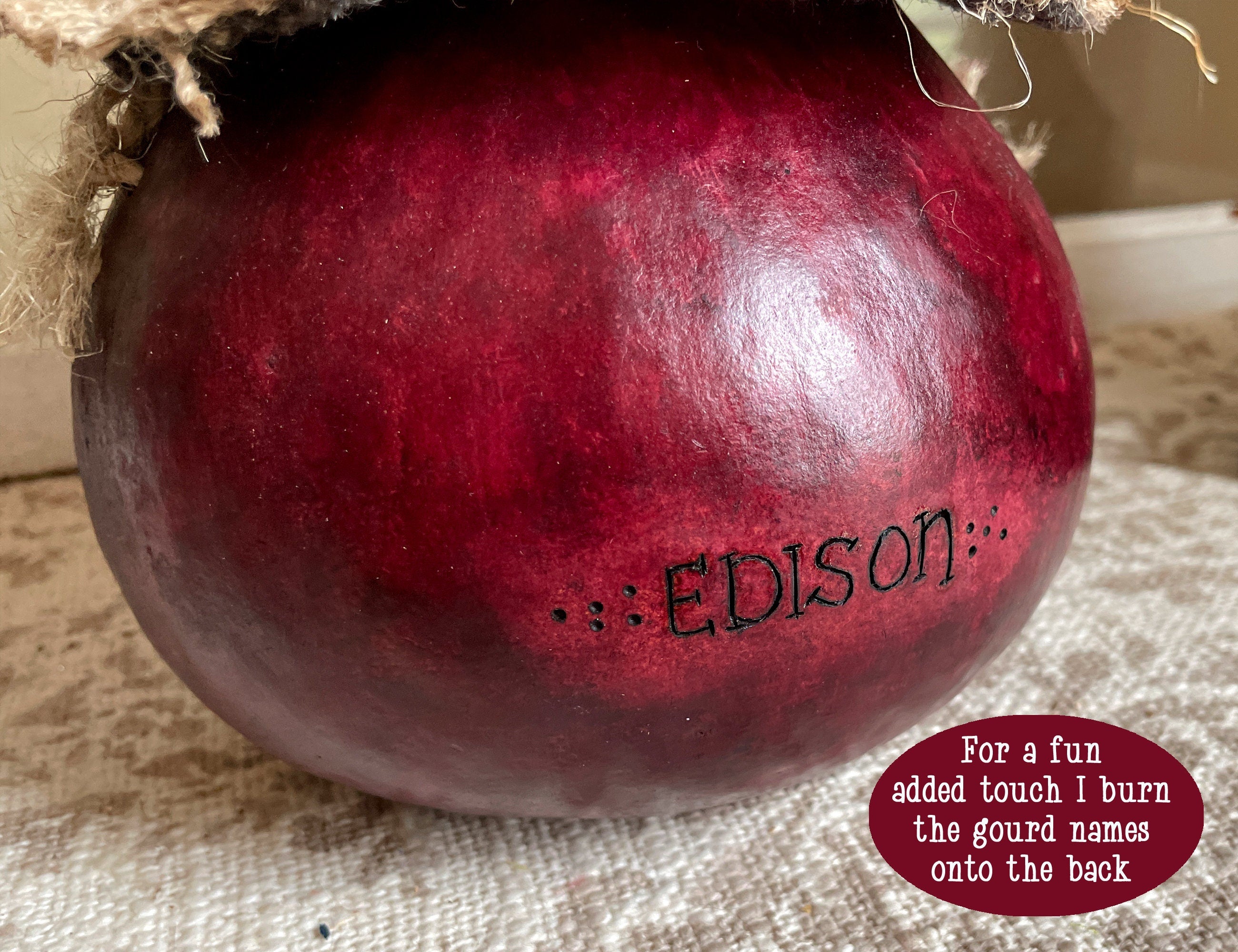 Purple gourd with 'Edison' engraved on a textured surface