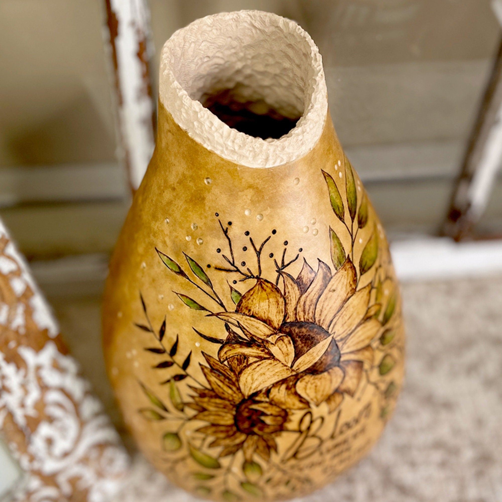 Decorative vase with floral design on a neutral background