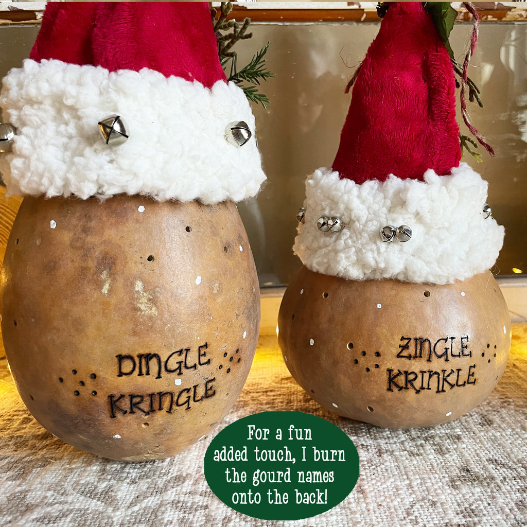 Two gourd ornaments with Santa hats and names 'Dingle Kringle' and 'Zingle Krinkle'.