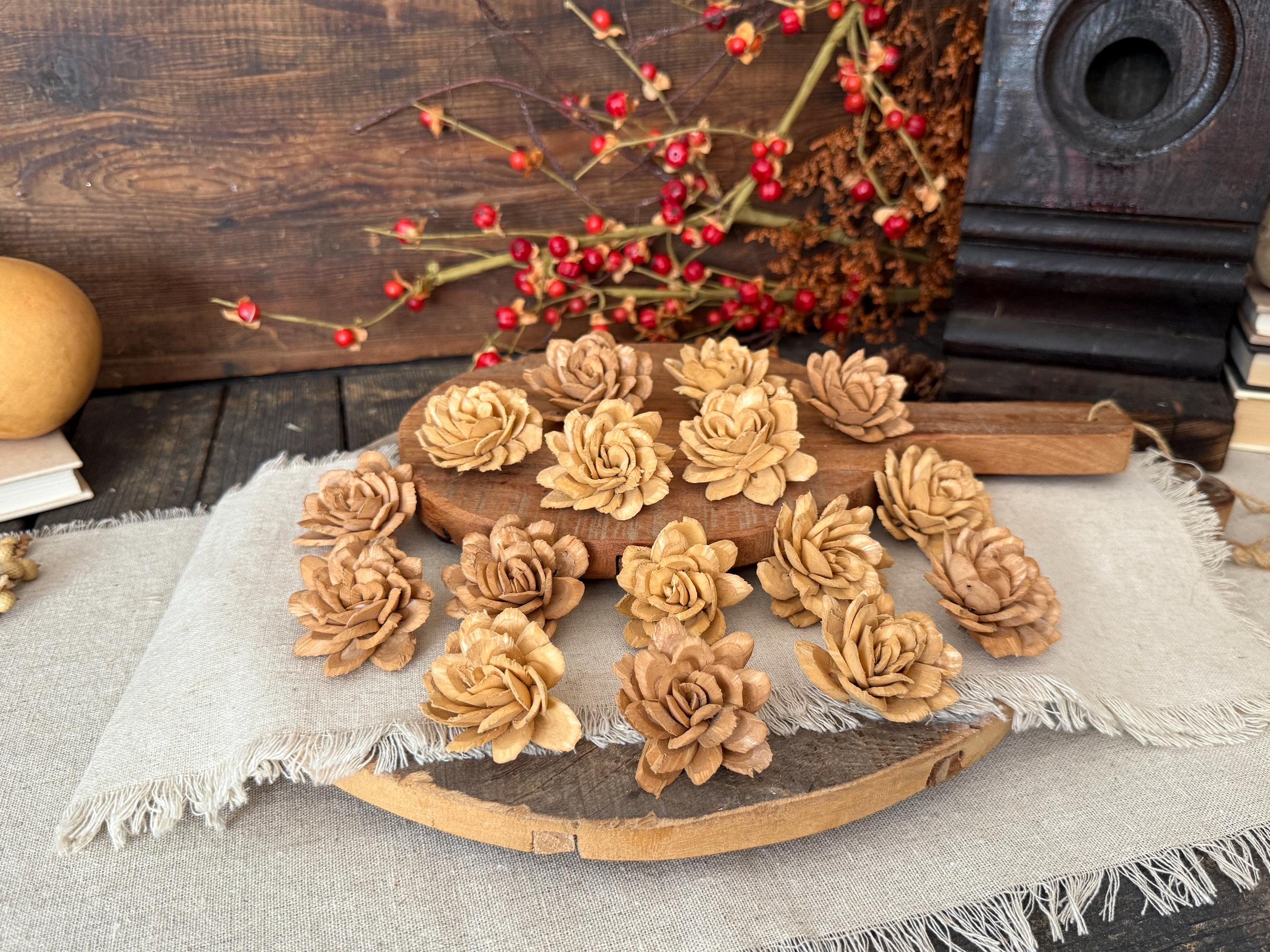 Wooden flower-shaped coasters on a wooden surface with a rustic background.