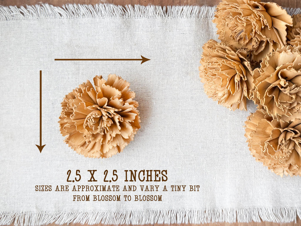Brown carnation wood flowers on a white textured surface with size indication text.