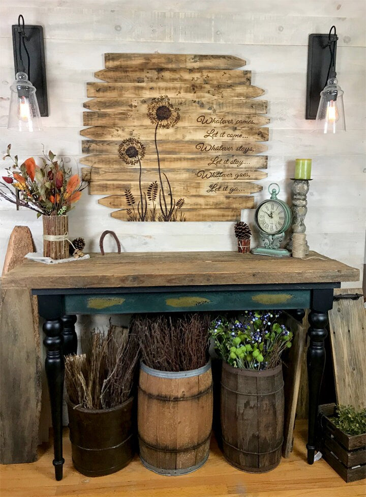 Rustic interior decor with wooden wall art, plants, and vintage furniture.