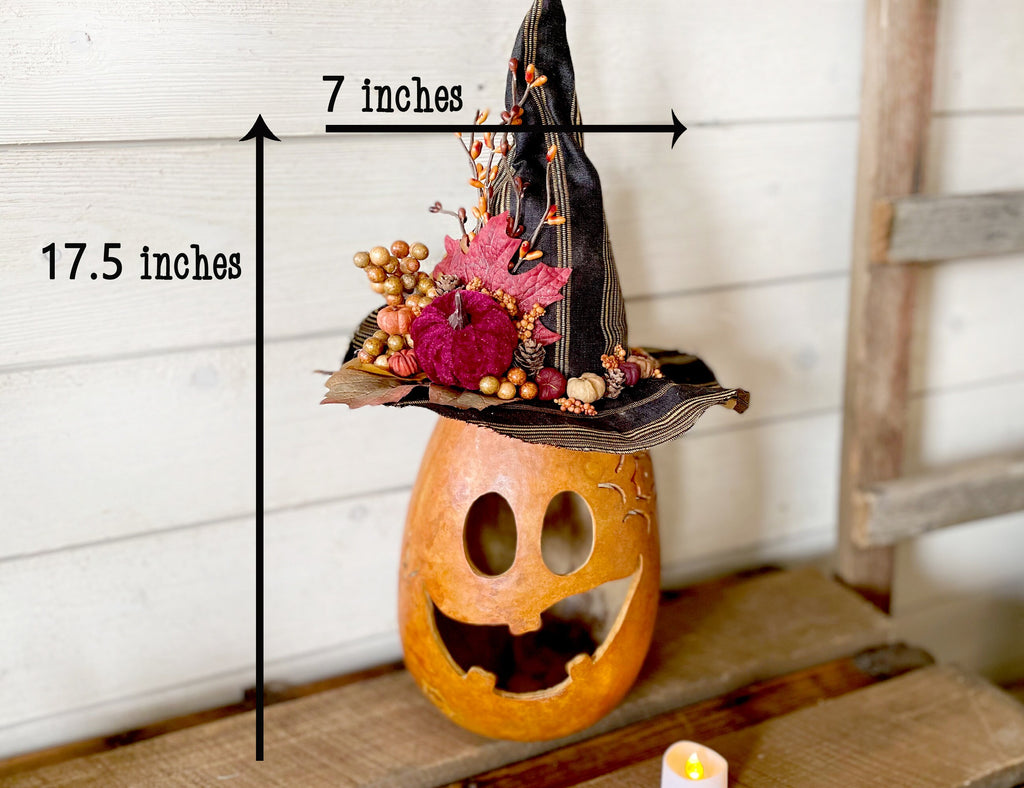 Decorative Halloween pumpkin with witch hat and measurements indicated
