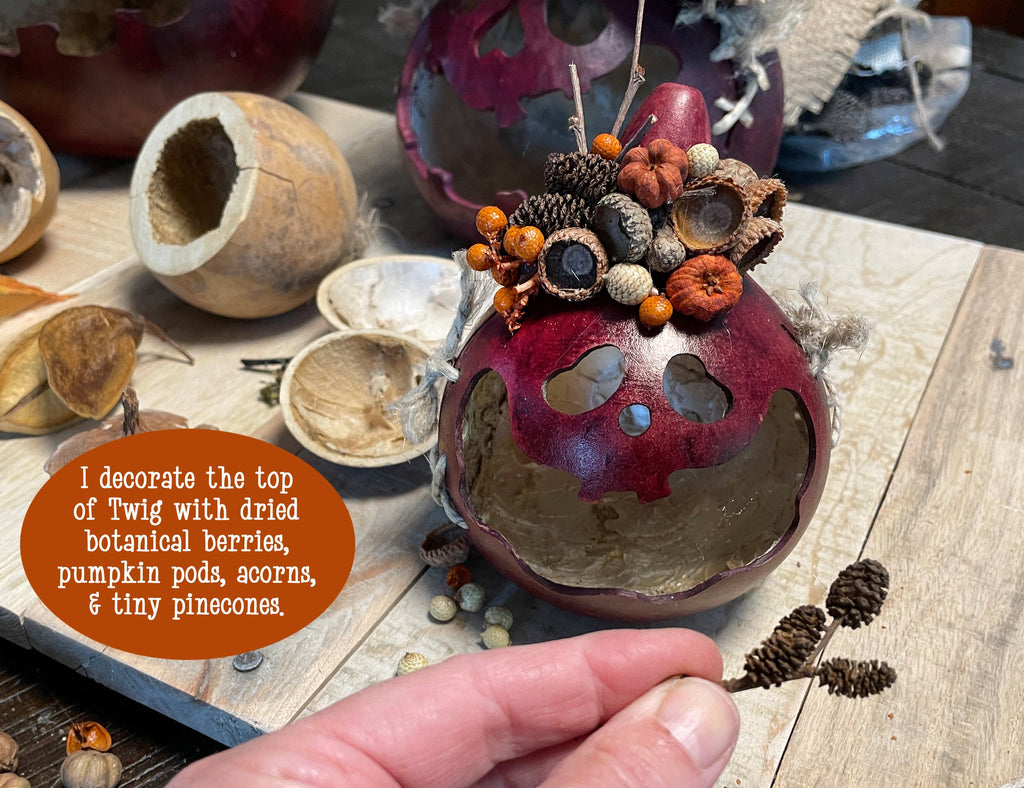 Decorative ornament with dried botanical elements on a wooden surface