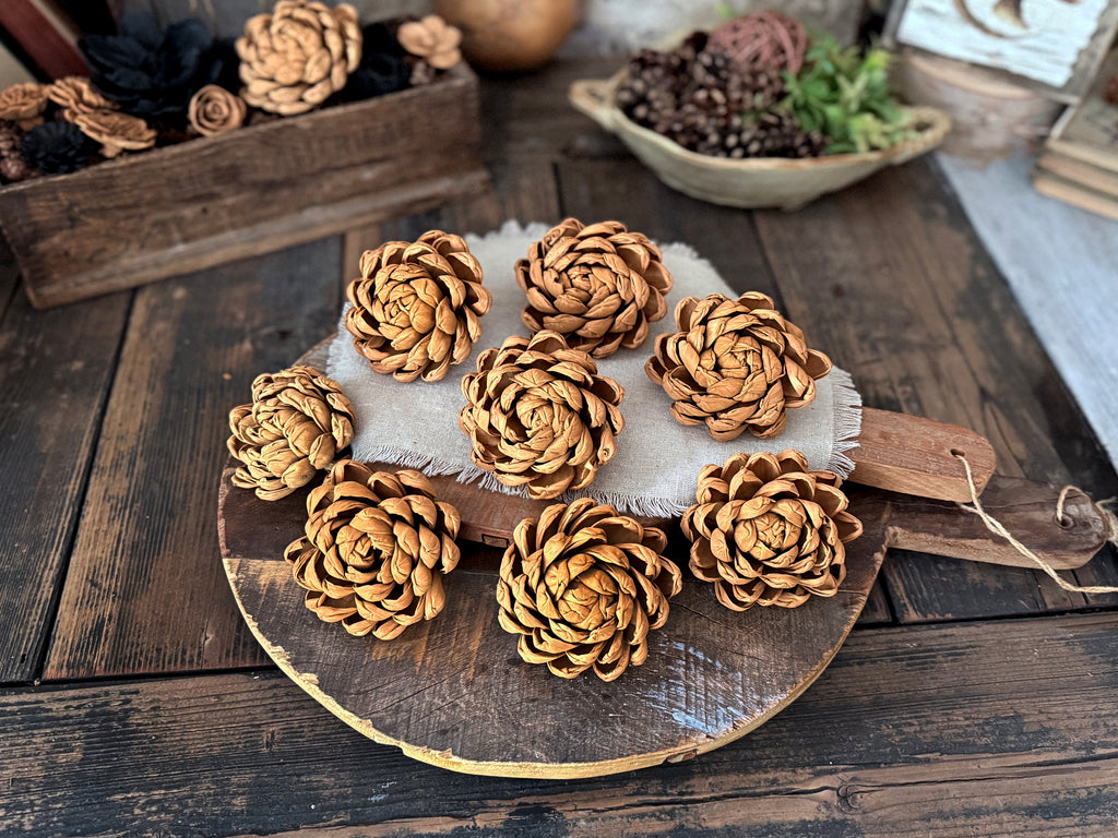 Decorative arrangement of butterscotch brown wood flower blossoms