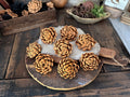 Decorative arrangement of butterscotch brown wood flower blossoms