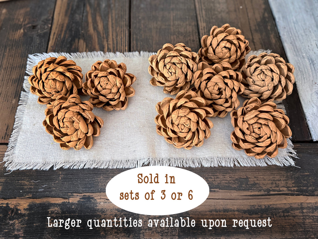 Round wood flowers on a textured surface with text about quantity availability.