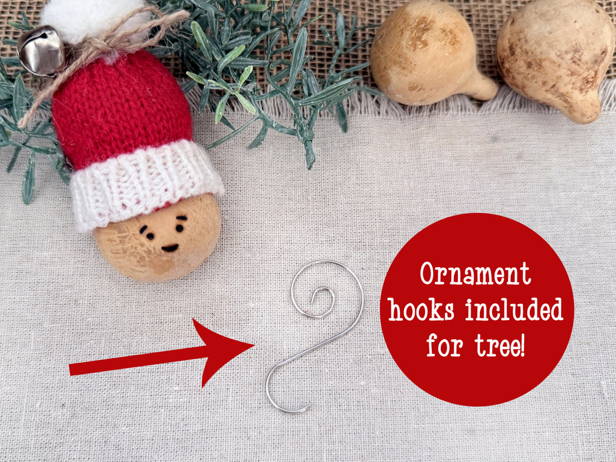 Image shows silver ornament hooks are included with purchase.