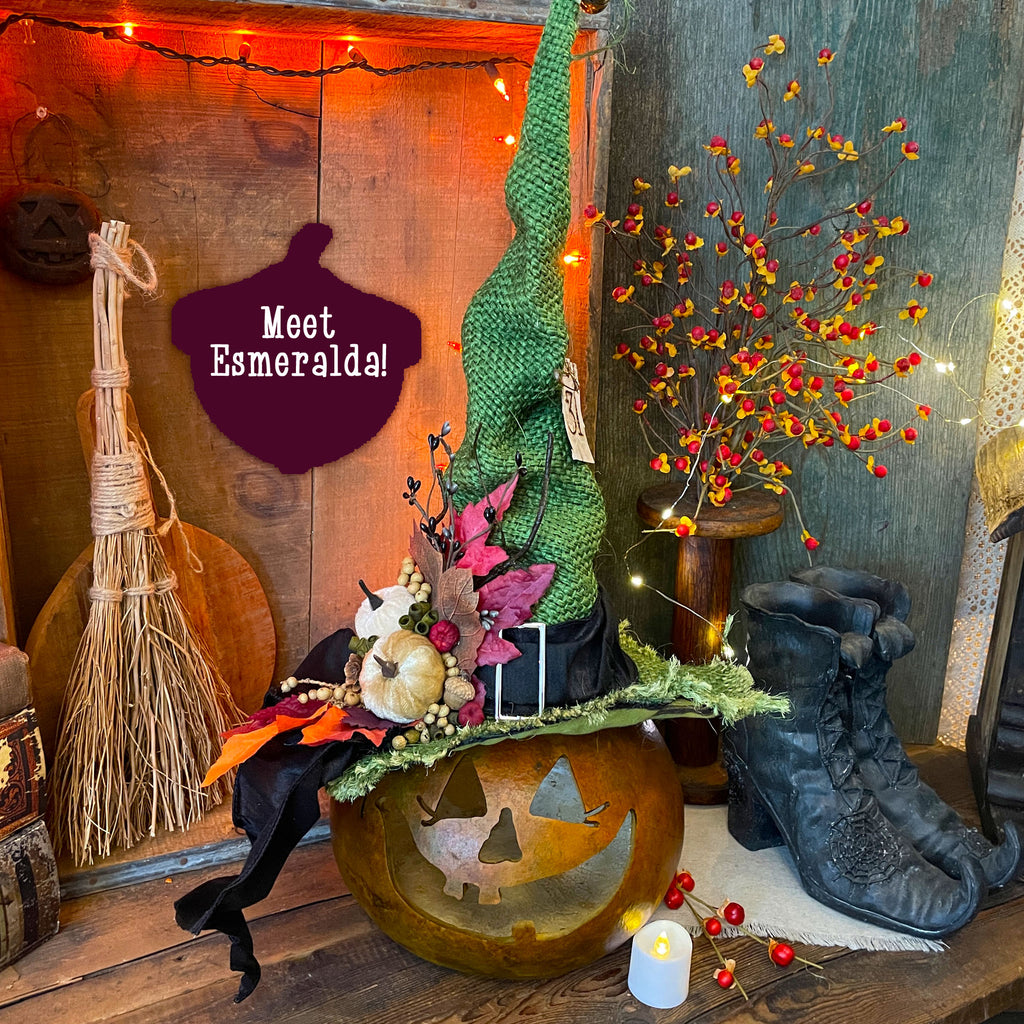 Hand carved Halloween gourd in a green witch them with a handcrafted and decorated witch hat. The witch's name is Esmeralda. 