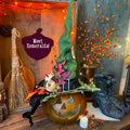 Hand carved Halloween gourd in a green witch them with a handcrafted and decorated witch hat. The witch's name is Esmeralda. 