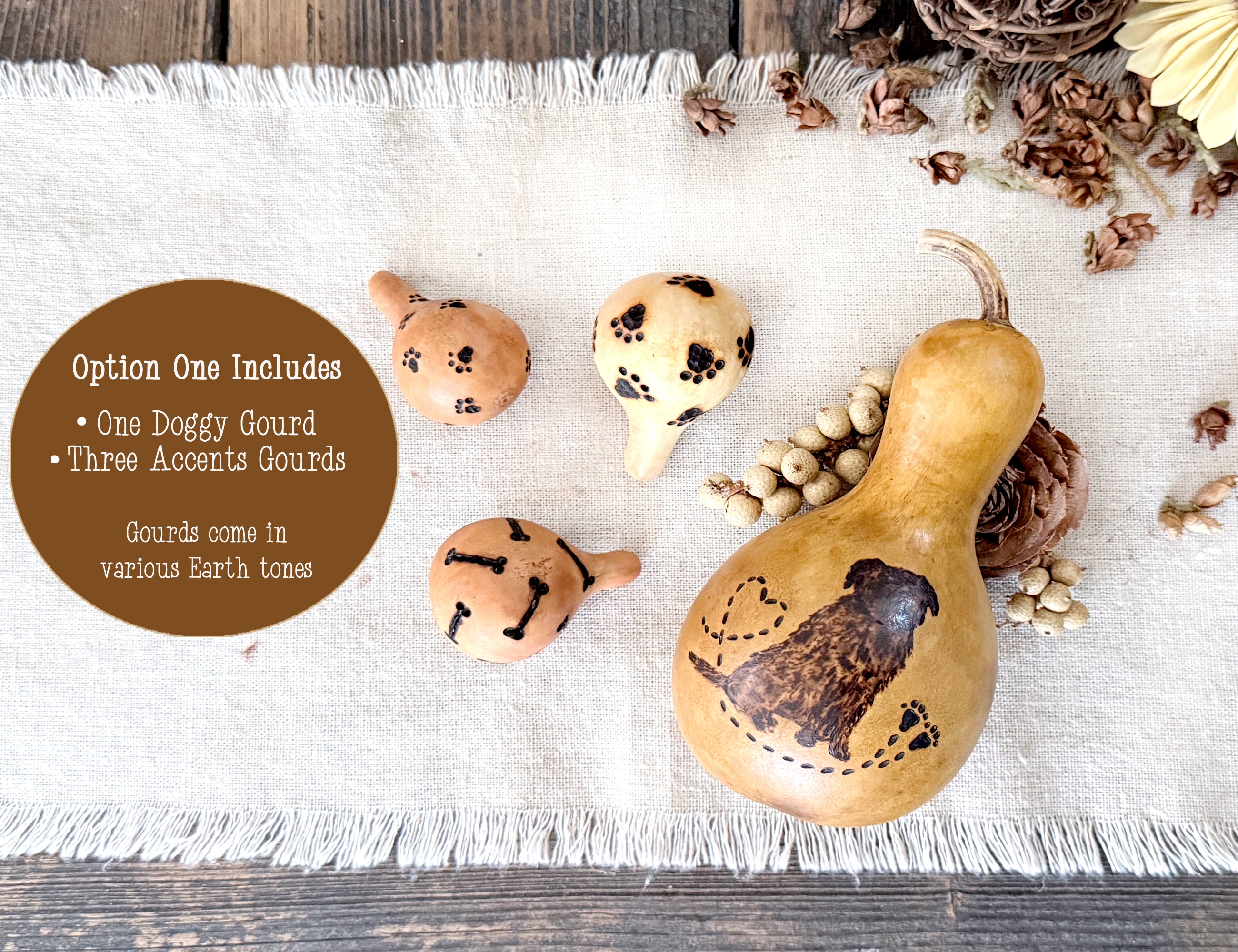 Decorative doggy gourds with earth-toned colors on a textured surface