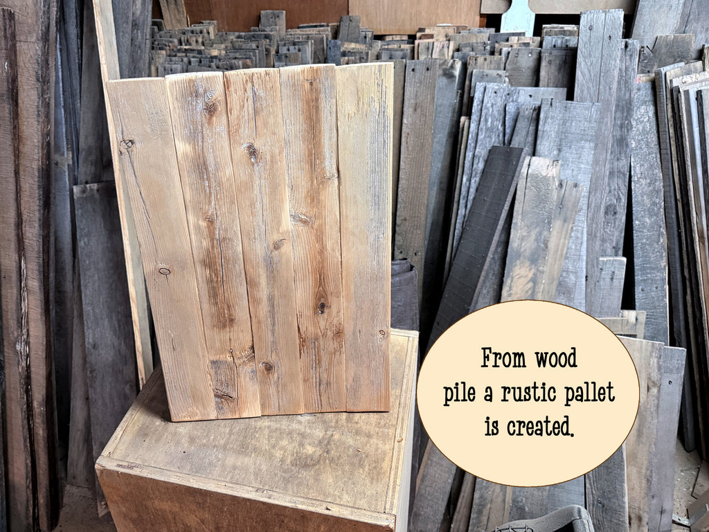 A rustic rectangular wooden pallet made from vertical weathered planks, displayed upright on a wooden crate in a storage yard. A beige circular text bubble reads, 'From wood pile a rustic pallet is created.
