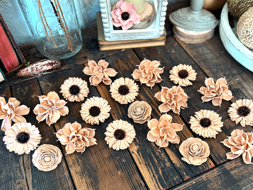 Decorative flowers on a wooden surface with a rustic background