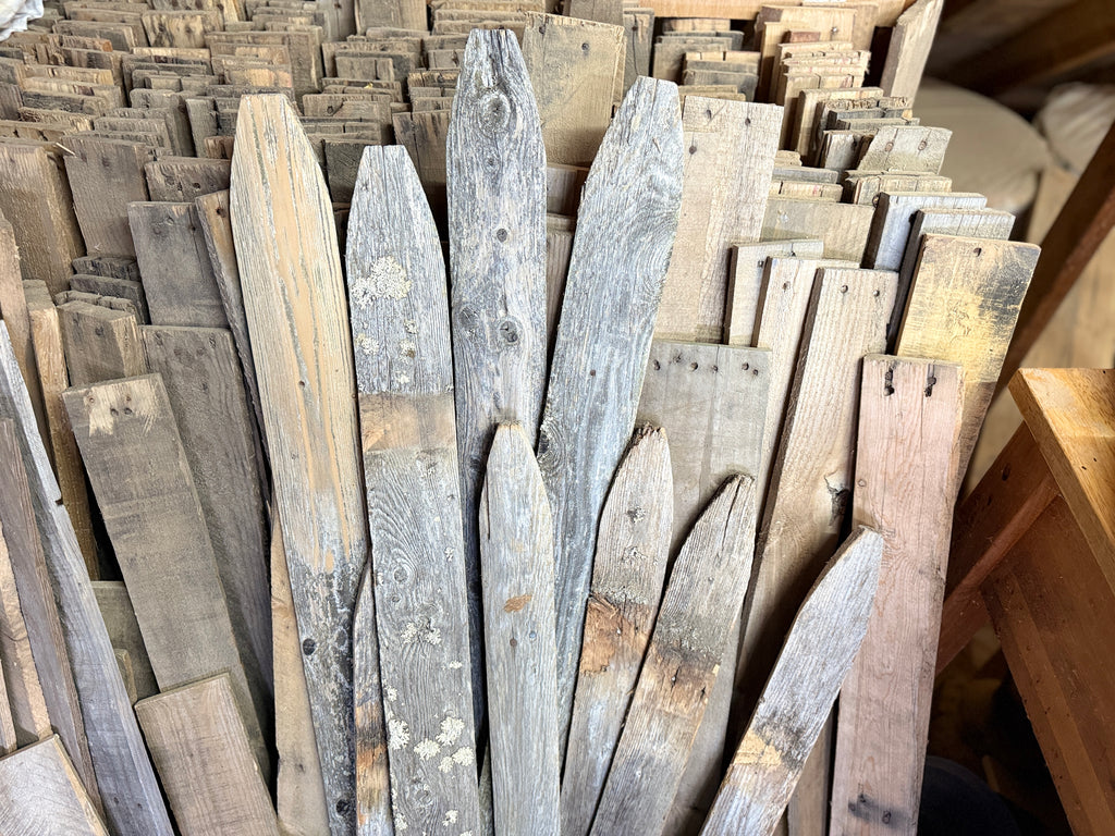 Image shows old wood collected to create pallets for wood signs.