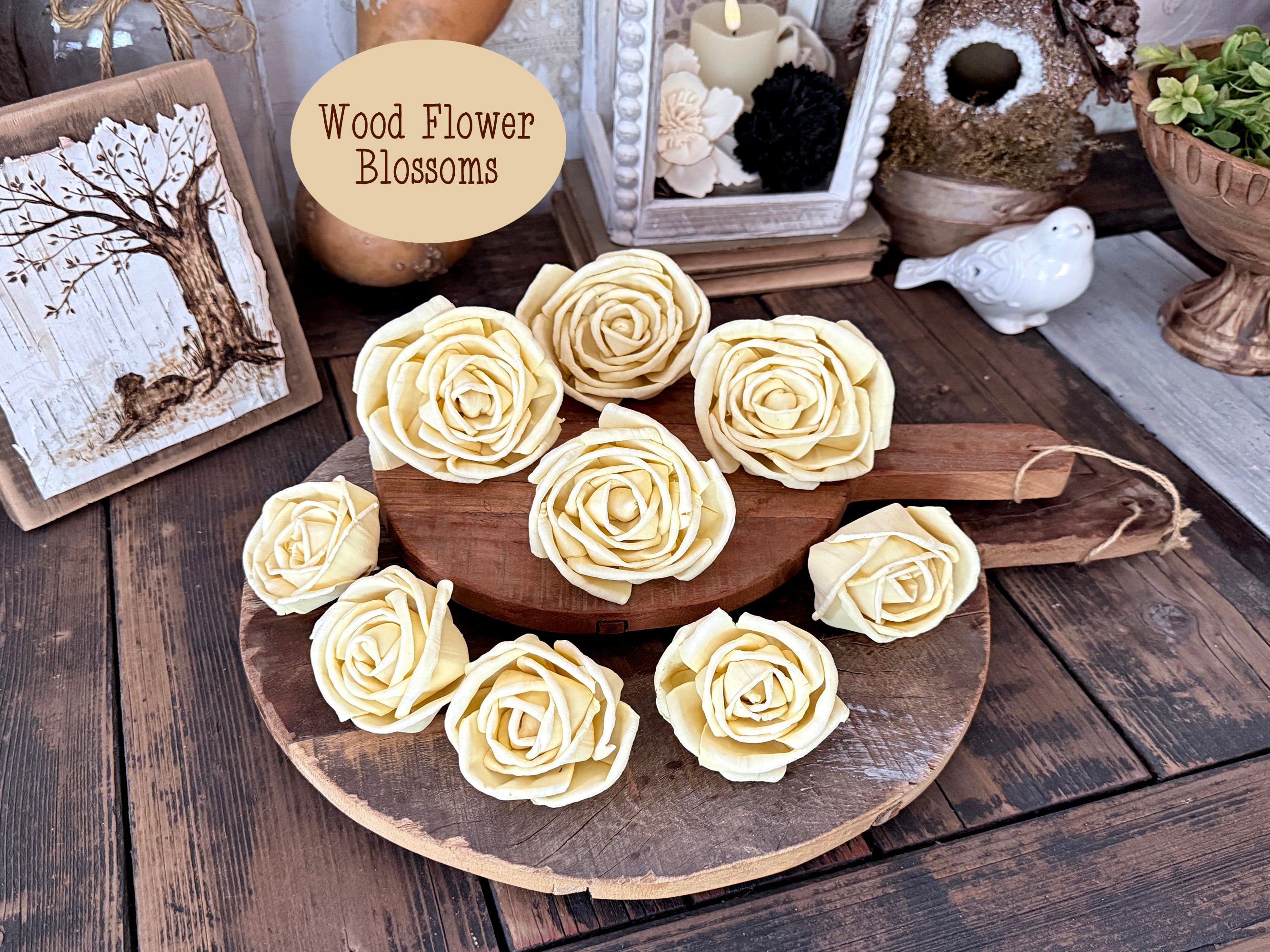 Wooden tray with decorative yellow rose blossoms on a rustic wooden surface.