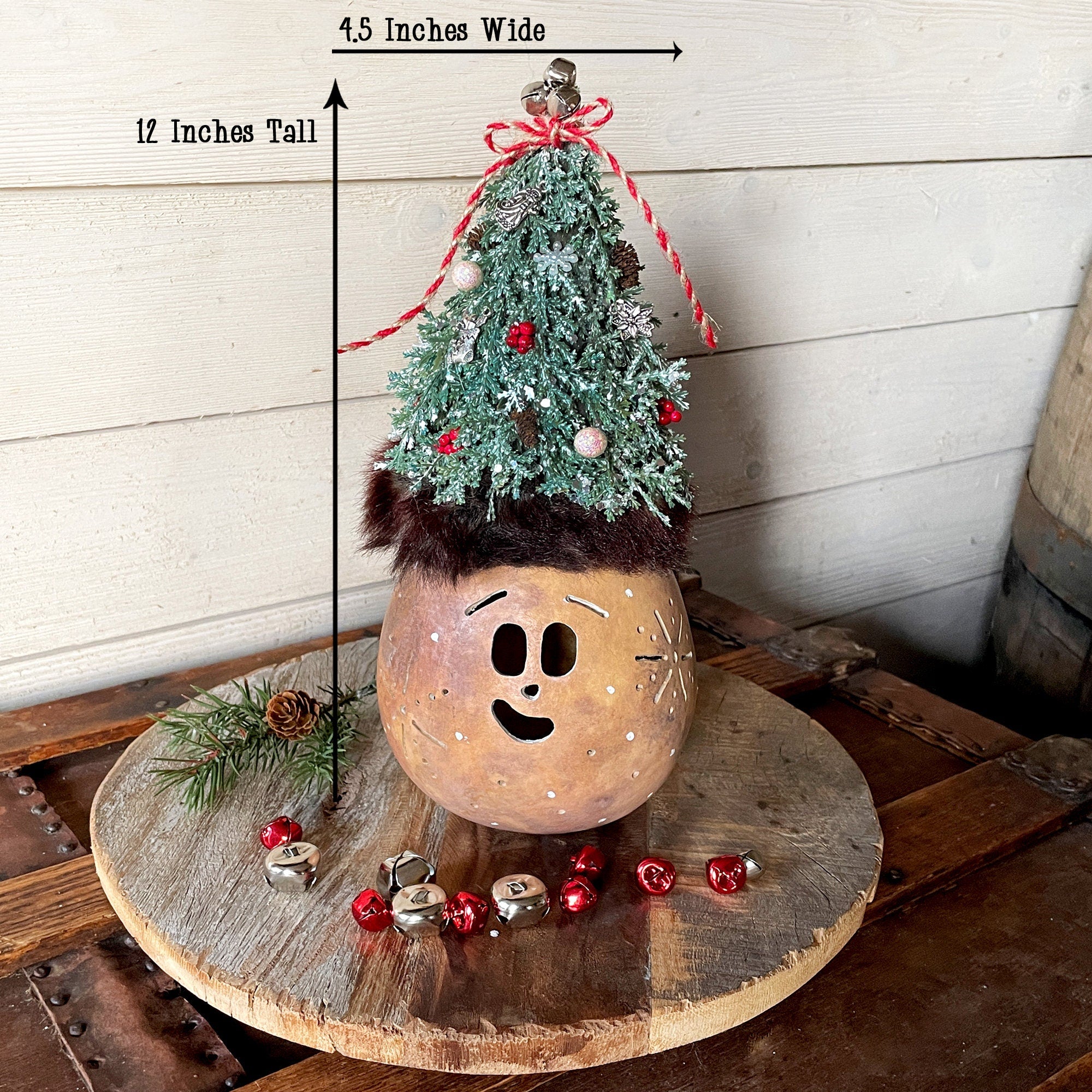 Decorative Christmas tree on a wooden base with measurements indicated