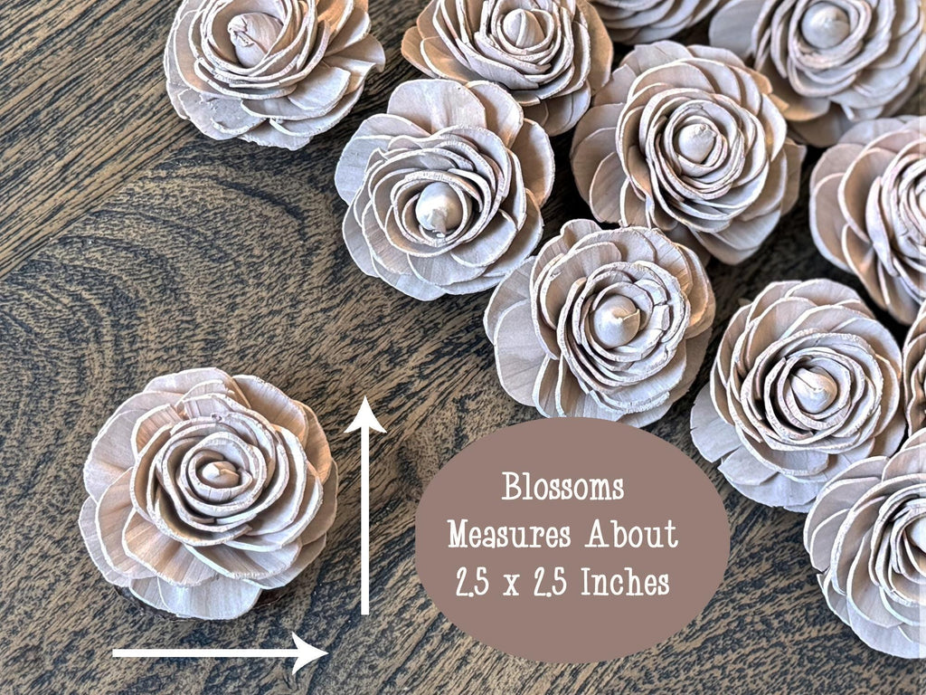 Decorative wood flowers on a wooden surface with text indicating size.