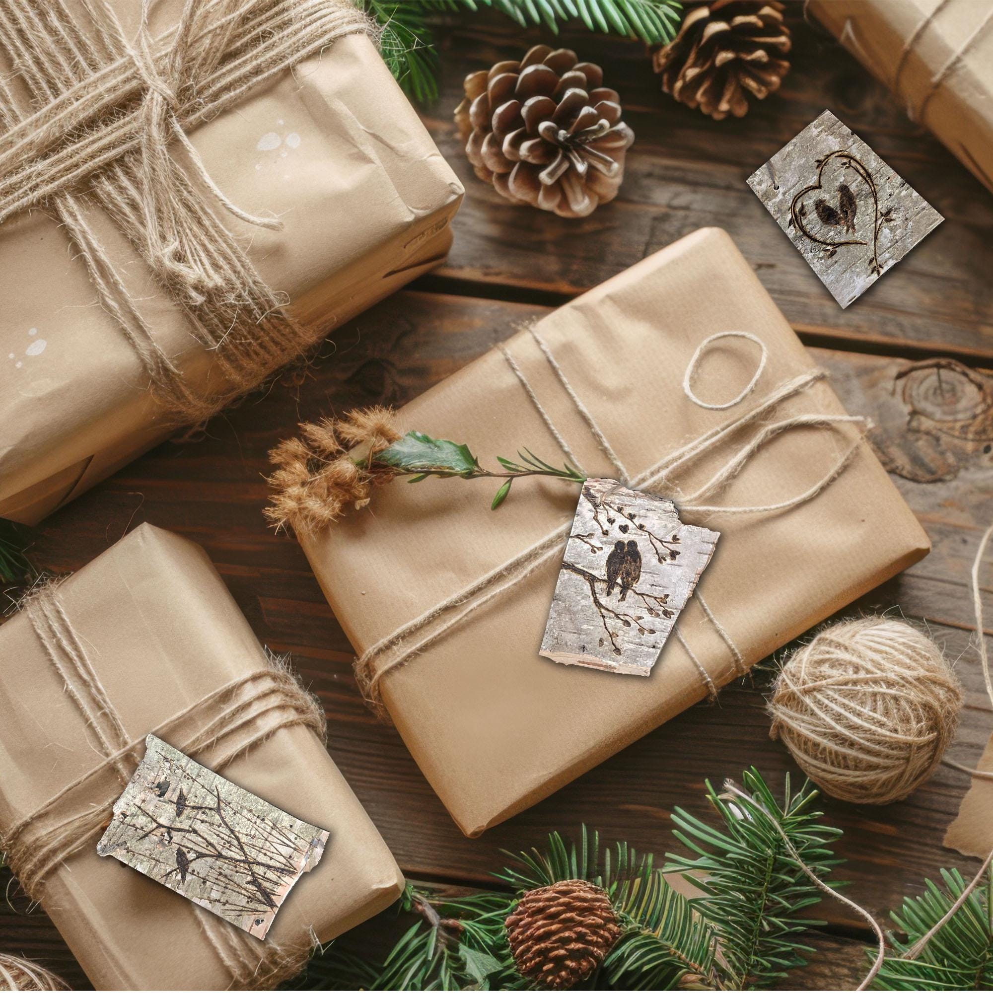 Gifts wrapped in brown paper with string, pine cones, and a decorative tag on a wooden surface.