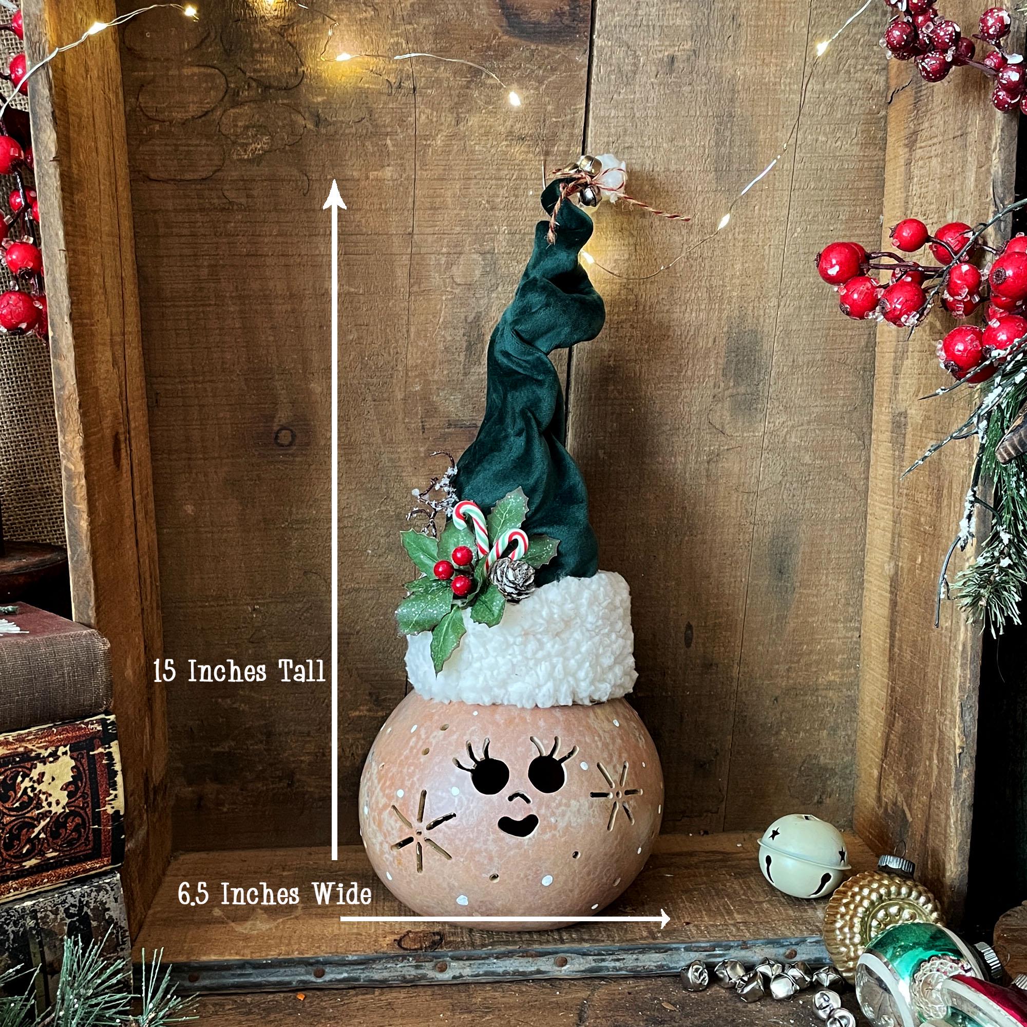 Christmas elf with measurements on a wooden background