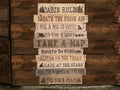 Wooden sign with 'Cabin Rules' on a wooden background