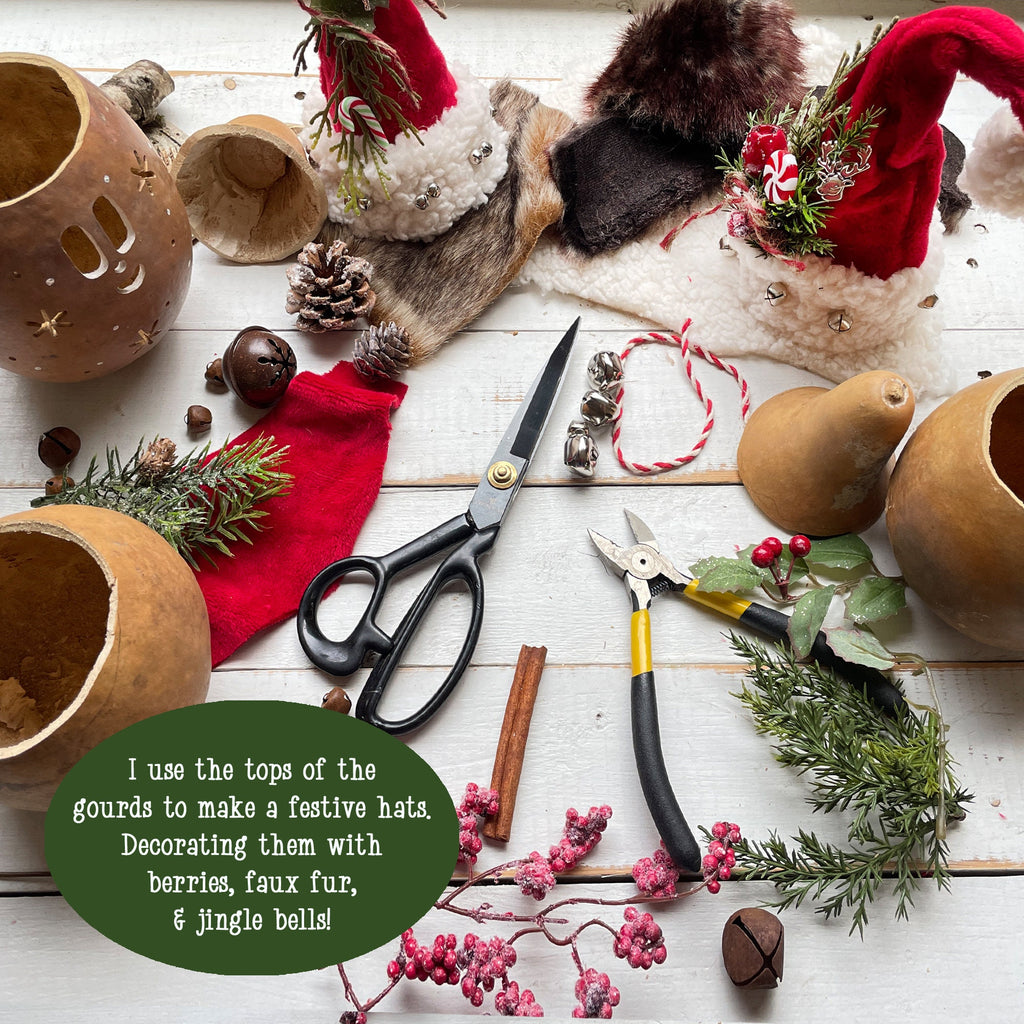 Decorative items including gourds, scissors, and festive hats on a wooden surface.