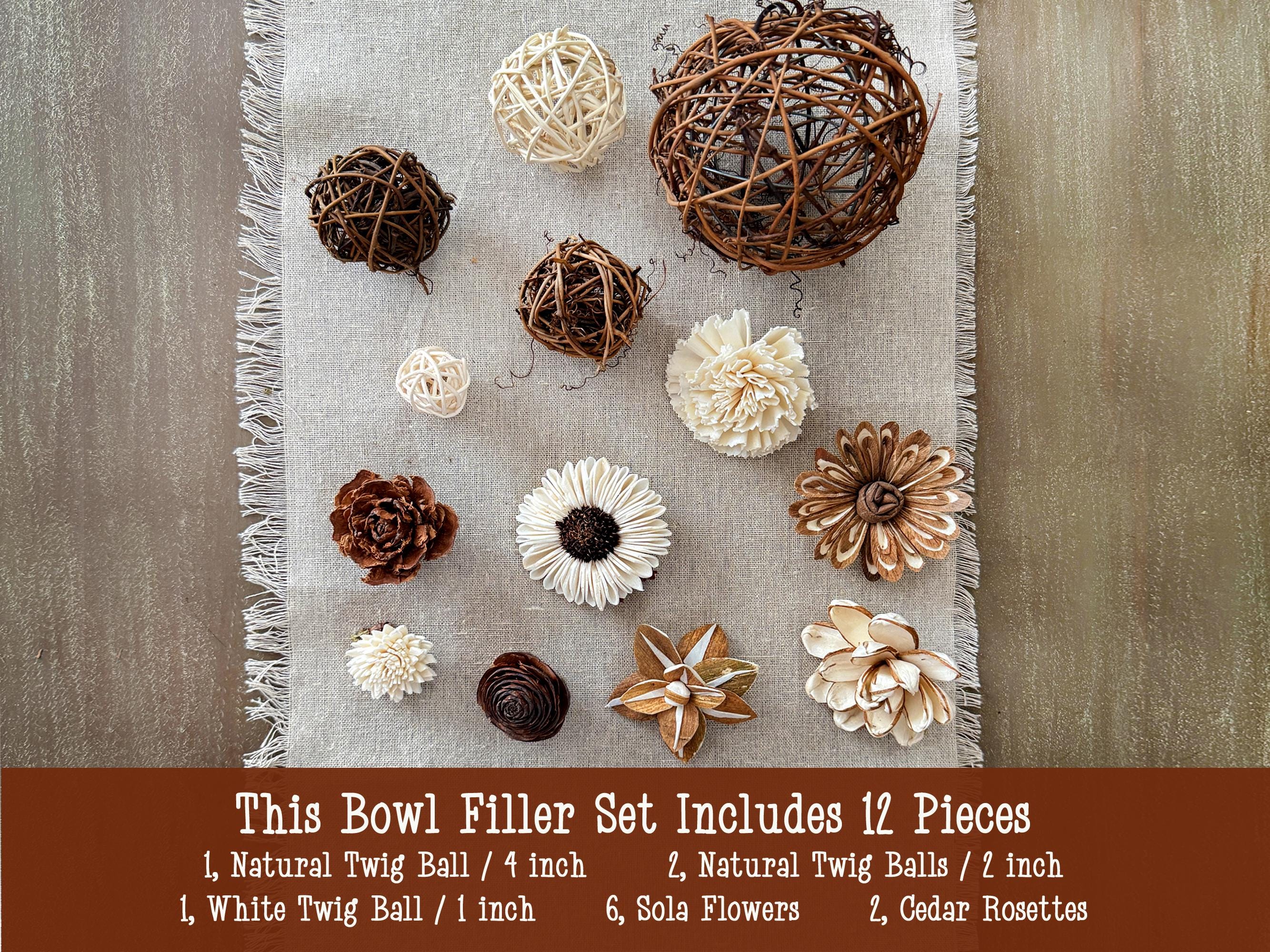 Set of natural twig balls, white twig balls, sola flowers, and cedar rosettes on a textured fabric with product details.