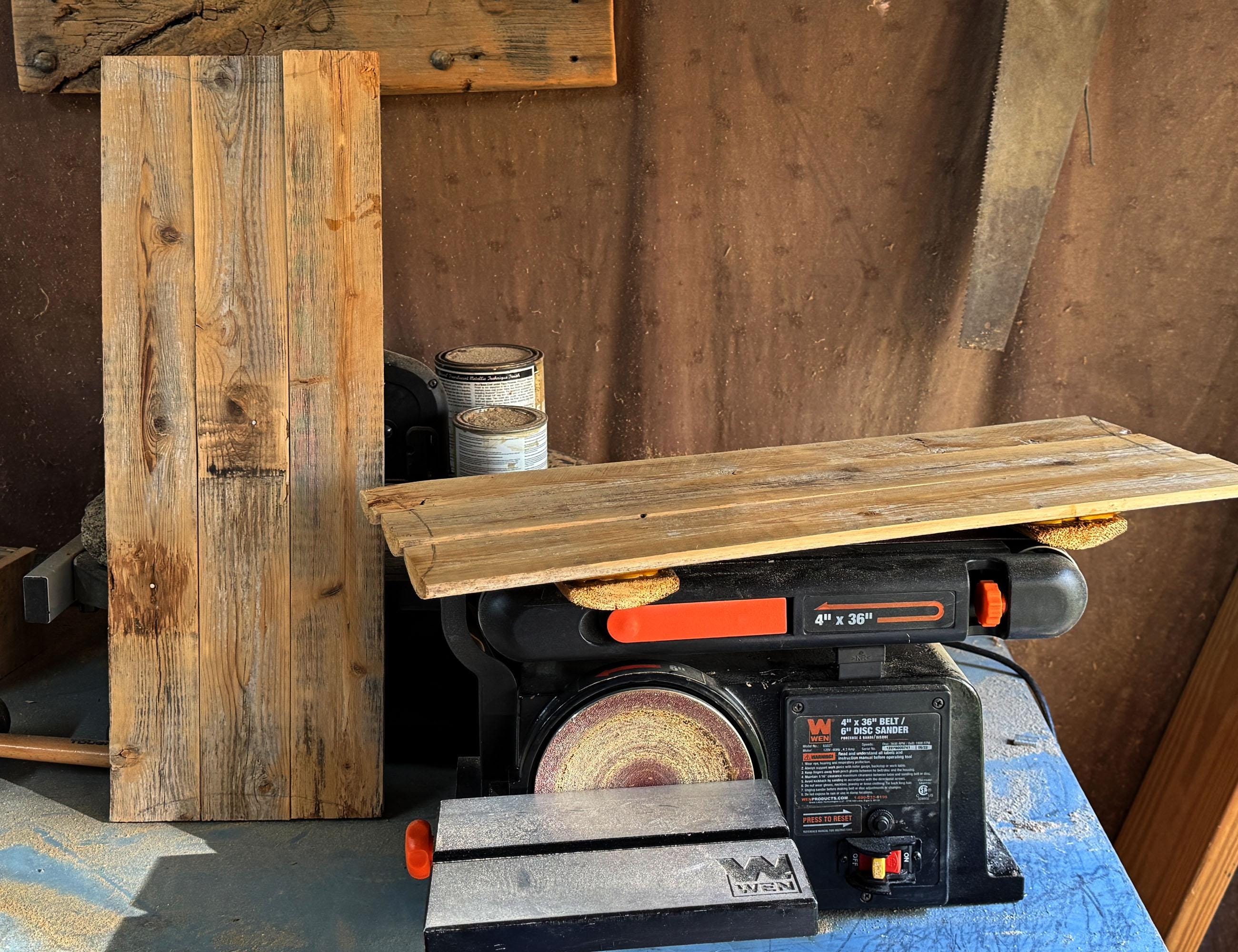 Woodworking project with a table saw and wooden planks against a rustic background