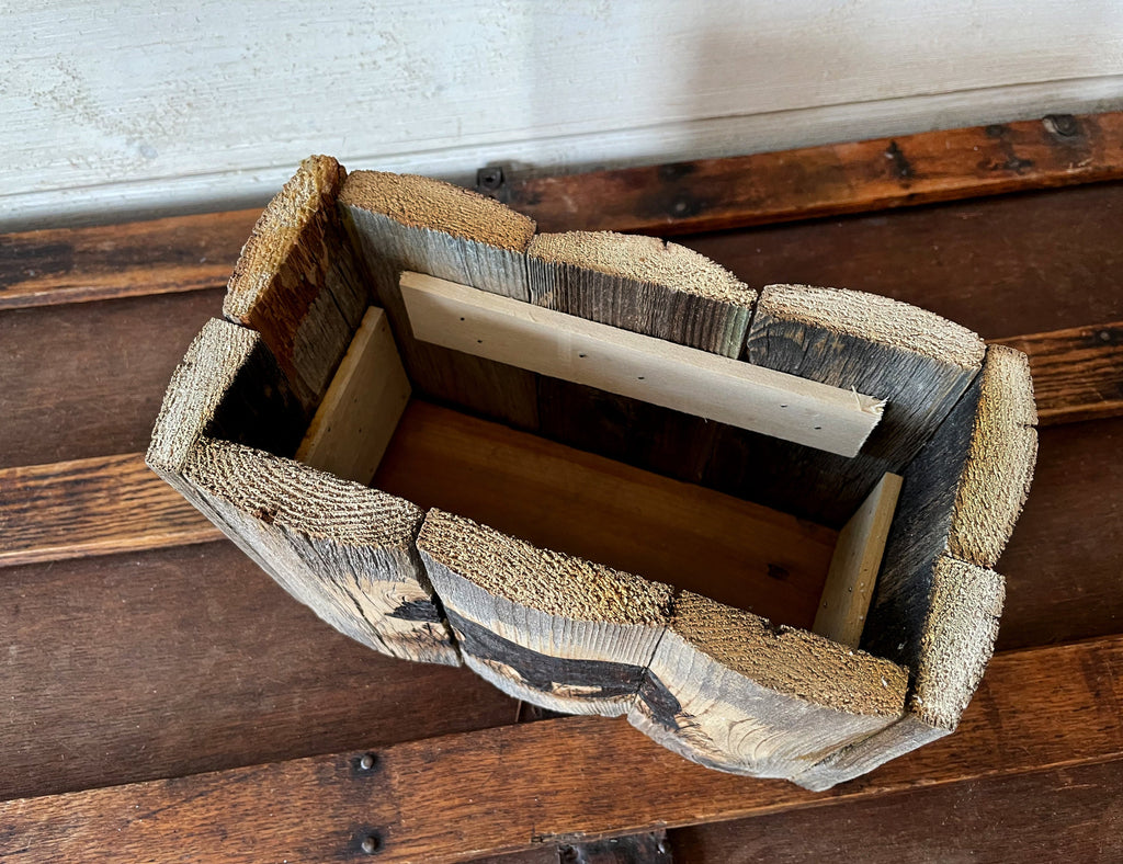 Wooden box with a textured surface on a wooden surface