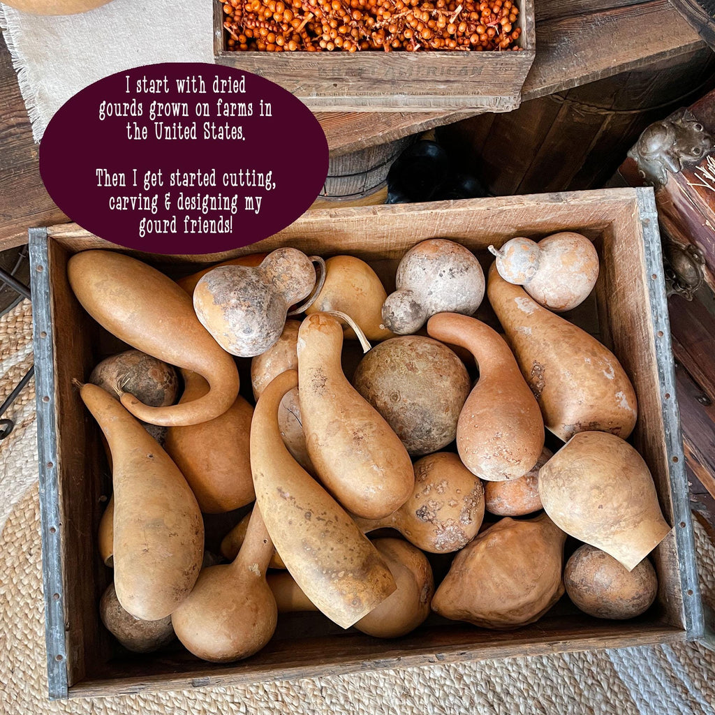 Box of gourds with text about their origin and creation process.