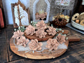 Decorative flowers on a wooden stand with a rustic background