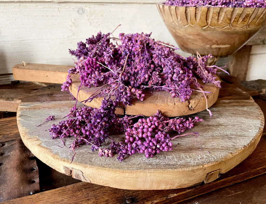 Natural Purple bowl filler on a wooden surface with a rustic background