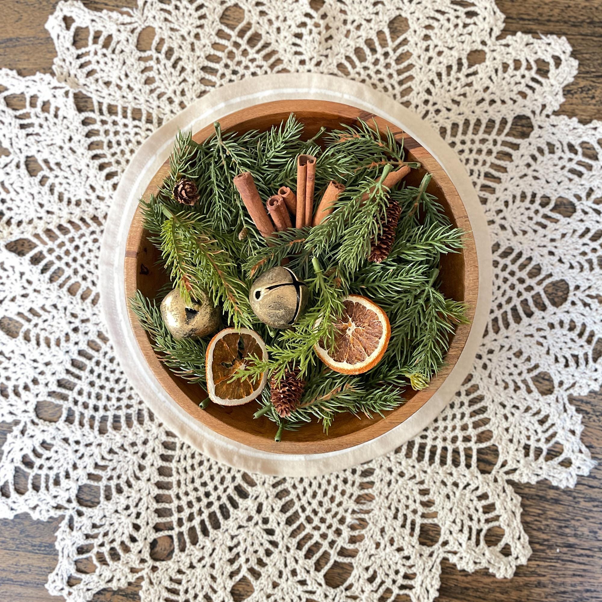 Wooden bowl with festive ingredients on a lace doily