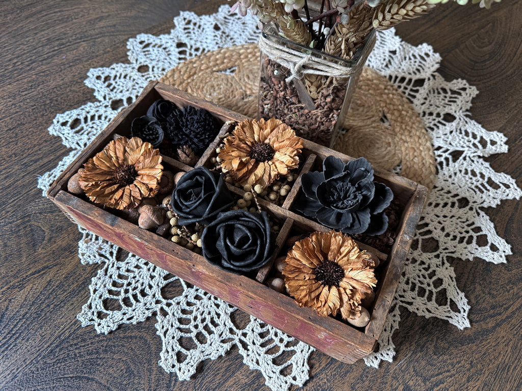 Wooden box with wood flowers on a lace doily