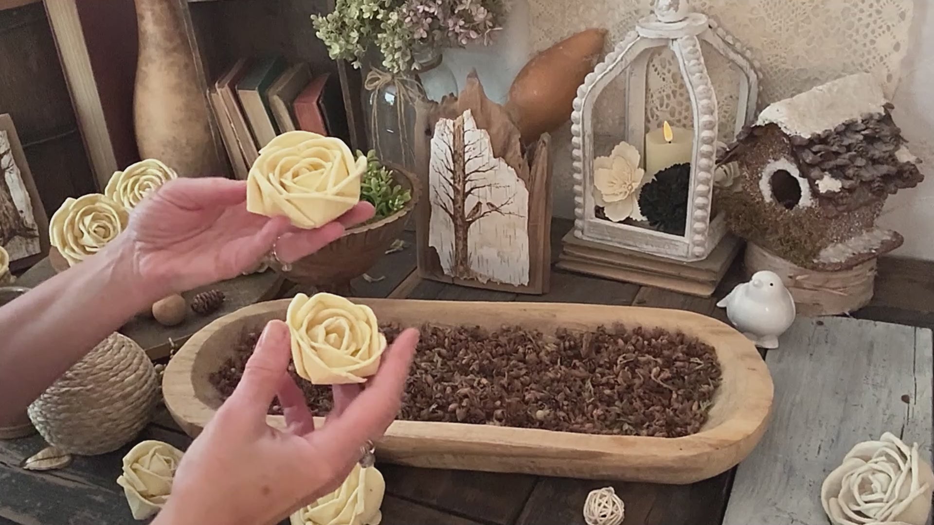 Video demo showing wooden dough bowl arrangement using dried pods and wood flowers.