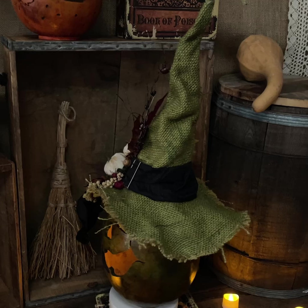 Video shows a 360 degree look of the Halloween gourd with hat.