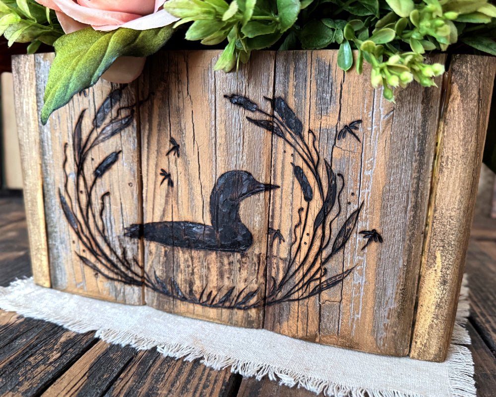 front of hand crafted loon wood planter