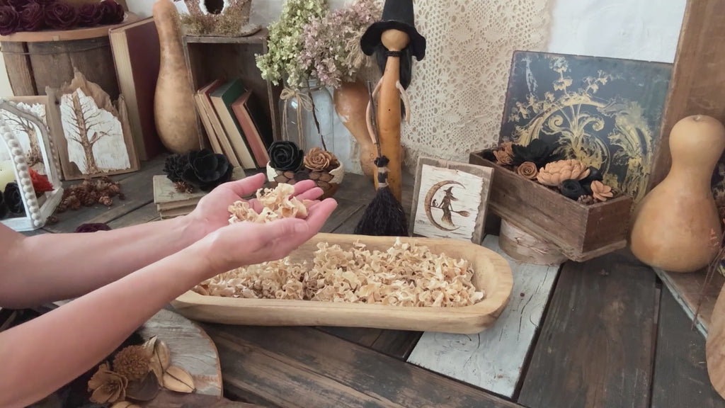 Video demo for a fall dough bowl arrangement featuring black and maroon flowers. 