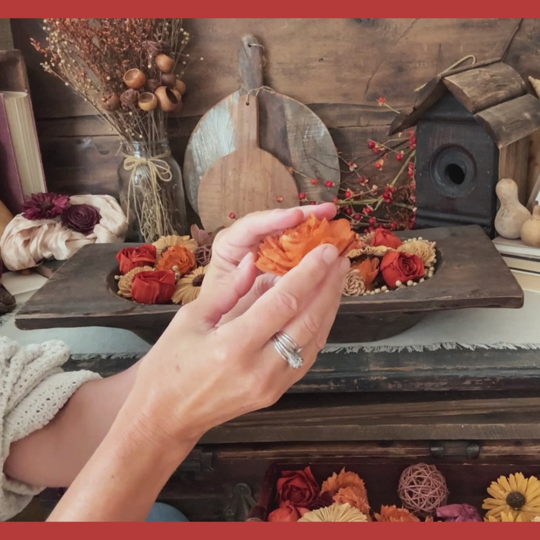 a video showing a large autumn dough bowl arrangement with wood flower blossoms