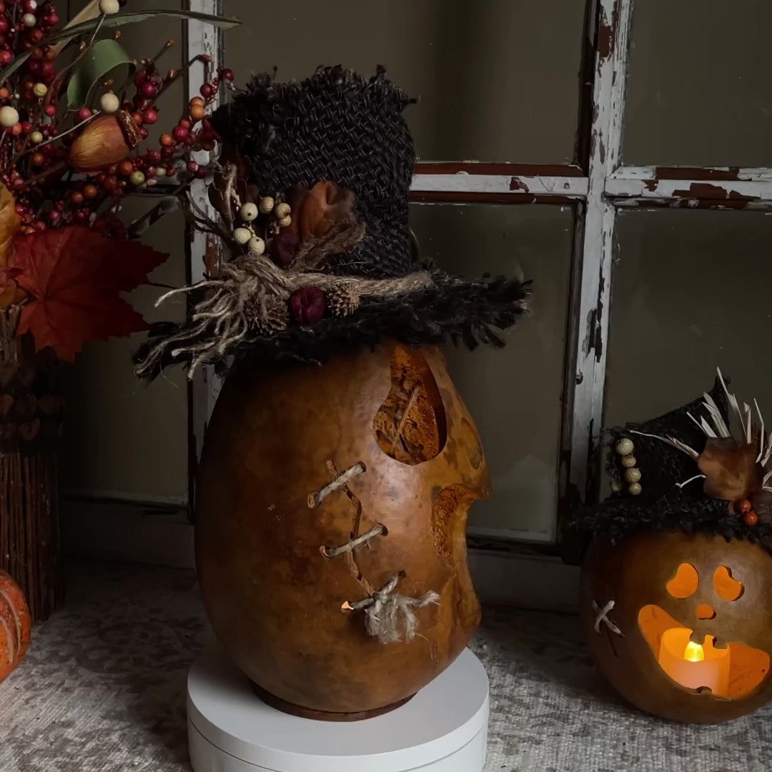 Rustic ghostly pumpkin with custom burlap hat. Lit with batter-operated candle.